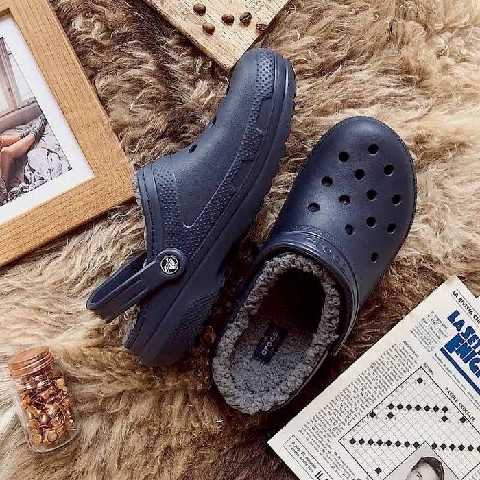 The Crocs on a faux fur rug