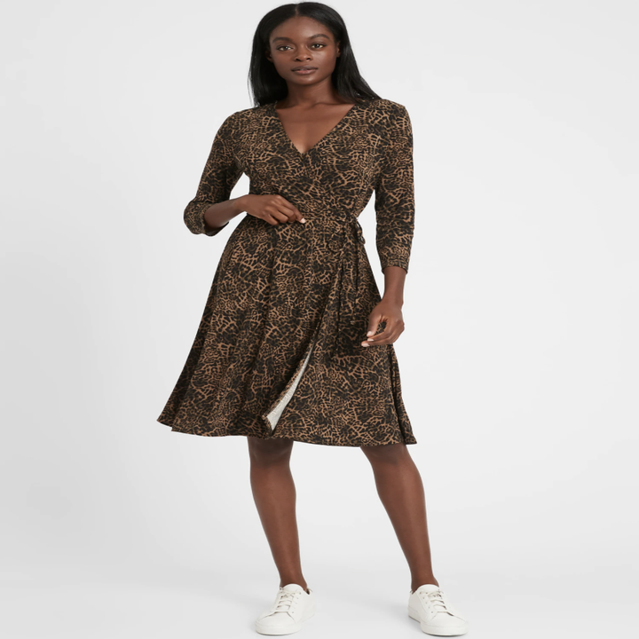 Model wearing Banana Republic wrap dress in brown leopard print pattern