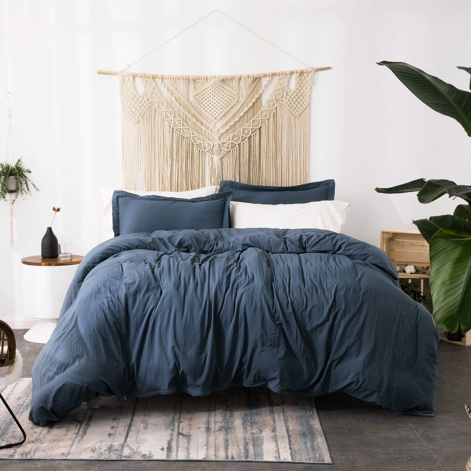 The bedding on a bed in a boho bedroom