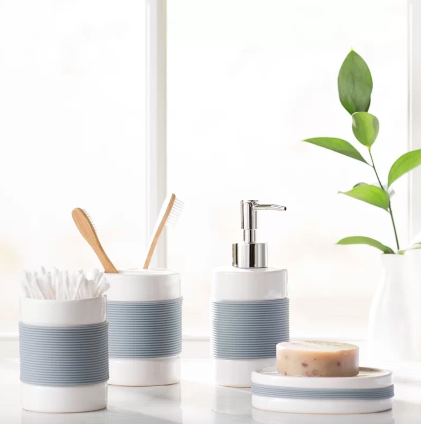 The four-piece bath accessory set in white and blue