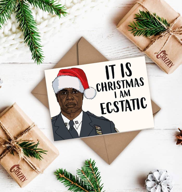 A card with a straight-faced Holt in a Santa hat that says &quot;It is Christmas I am ecstatic.&quot;