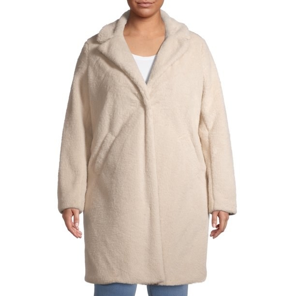 Model in white faux sherpa coat