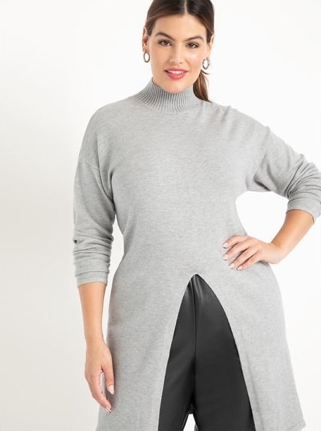 Model in split front mock neck tunic sweater 