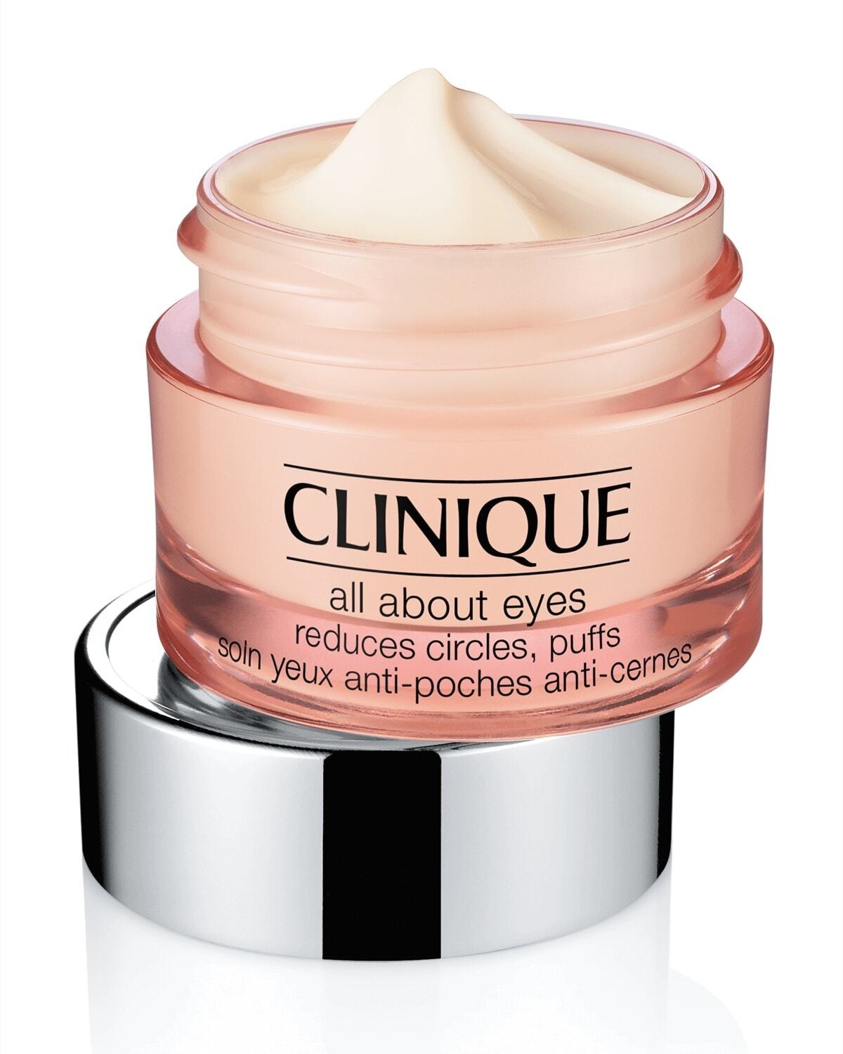 Pink jar of Clinique&#x27;s All About Eyes Eye Cream on top of a silver lid