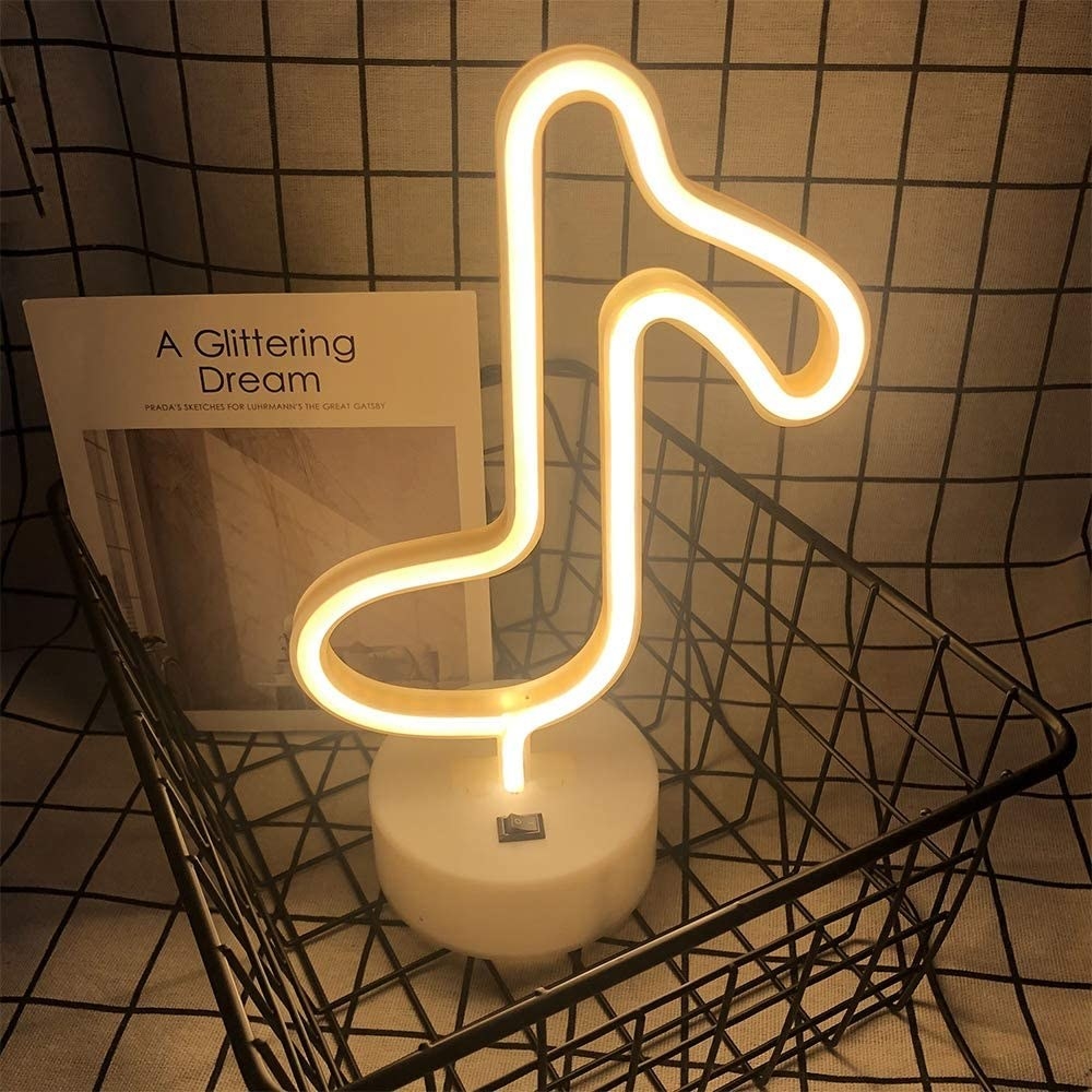 A neon light in the shape of a music note