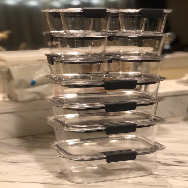 Reviewer photo of the 24-piece clear container set stacked in an organized column from largest at the bottom to smallest on the top 