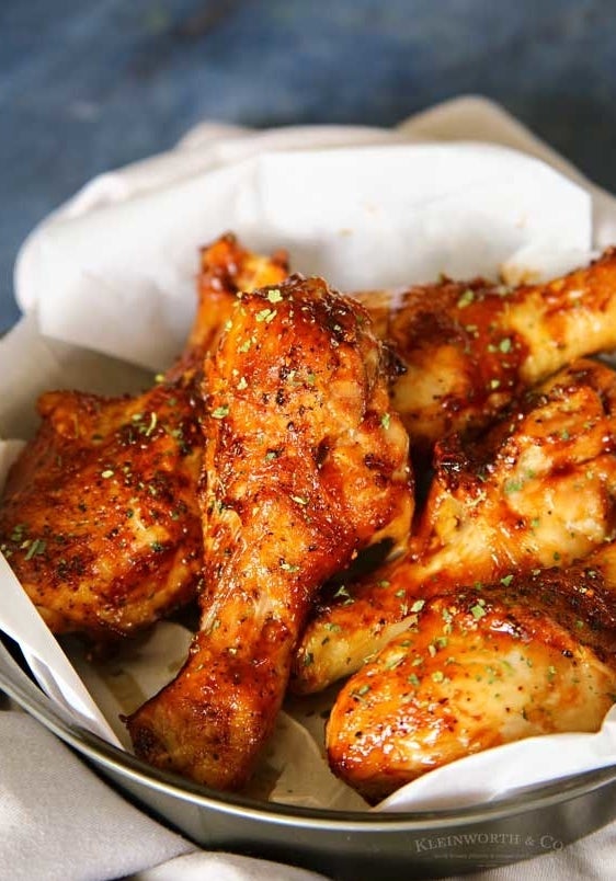 A bowl of apricot-glazed air fried drumsticks.