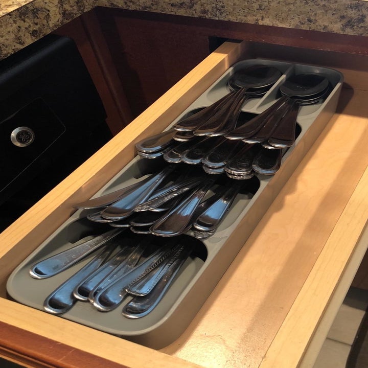 Reviewer photo of an open drawer with all their silverware organized in the drawer organizer 