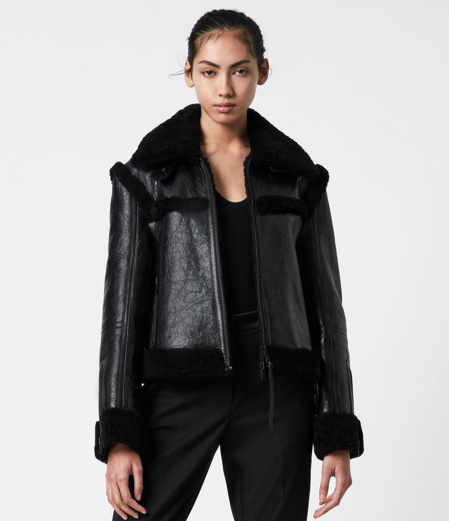 model wearing all-black jacket 
