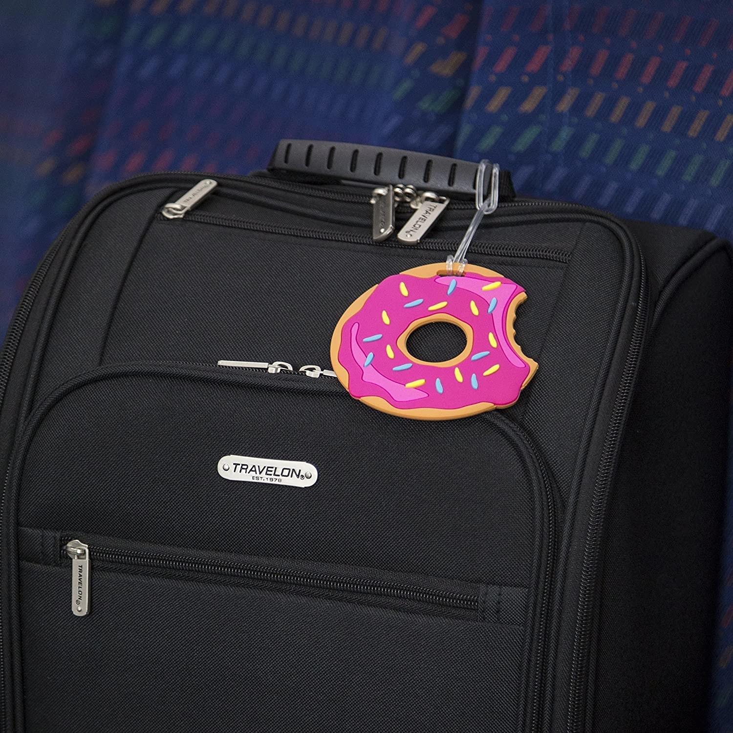 A donut tag attached to a suitcase