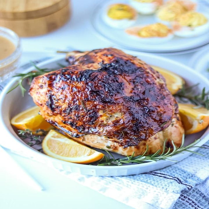 A crispy-skinned turkey breast in a serving bowl.
