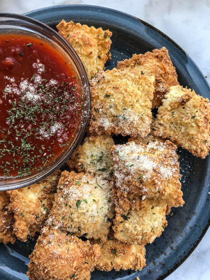 Crispy toasted ravioli with dipping sauce.