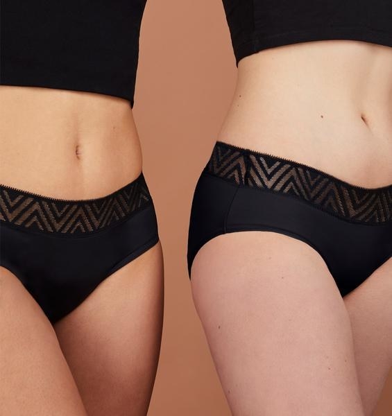 Two models wearing the hiphugger period underwear in black