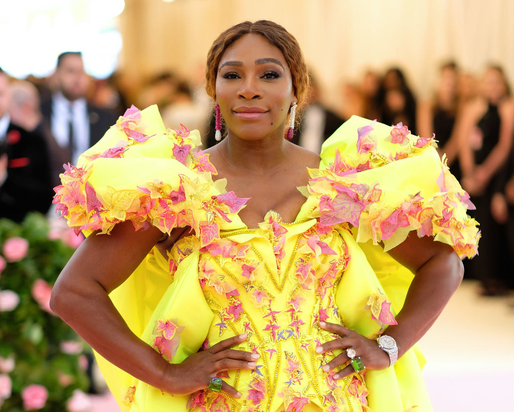 Serena wearing an elegant floral dress