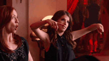 Anna Kendrick raising her arms and saying, &quot;Boom!&quot;