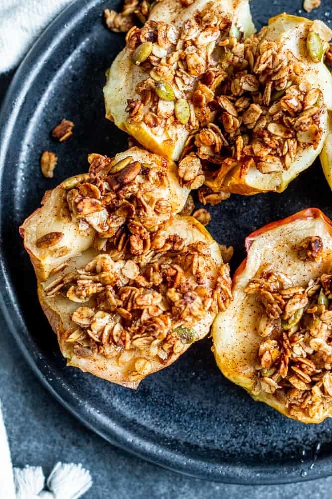 Three baked apples topped with honey oat crumble.