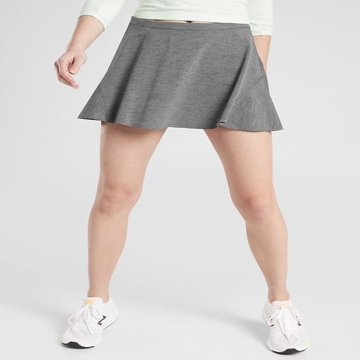 A model wearing the skort in grey
