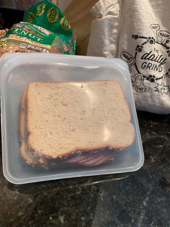 A reviewer photo of a sandwich in a clear silicone storage bag 