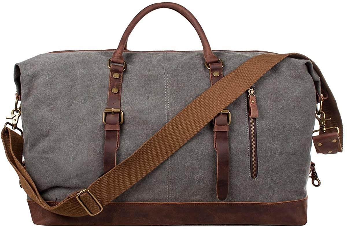 Gray duffel bag with brown leather and strap