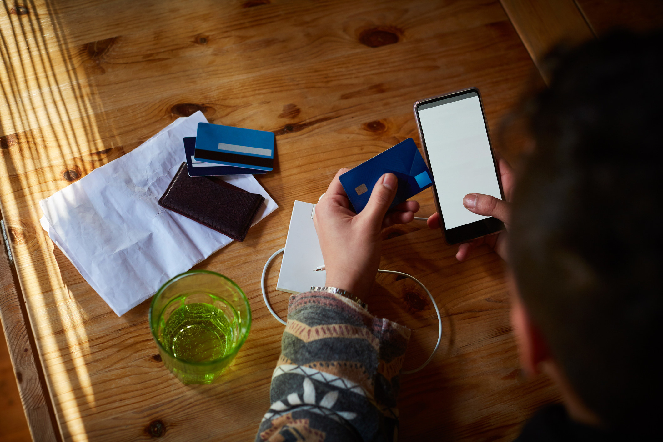 Person checking credit card info on phone