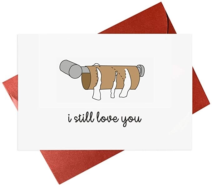 A white card with a color drawing of a toilet paper roll with all the paper gone, and "i still love you" written in black cursive below