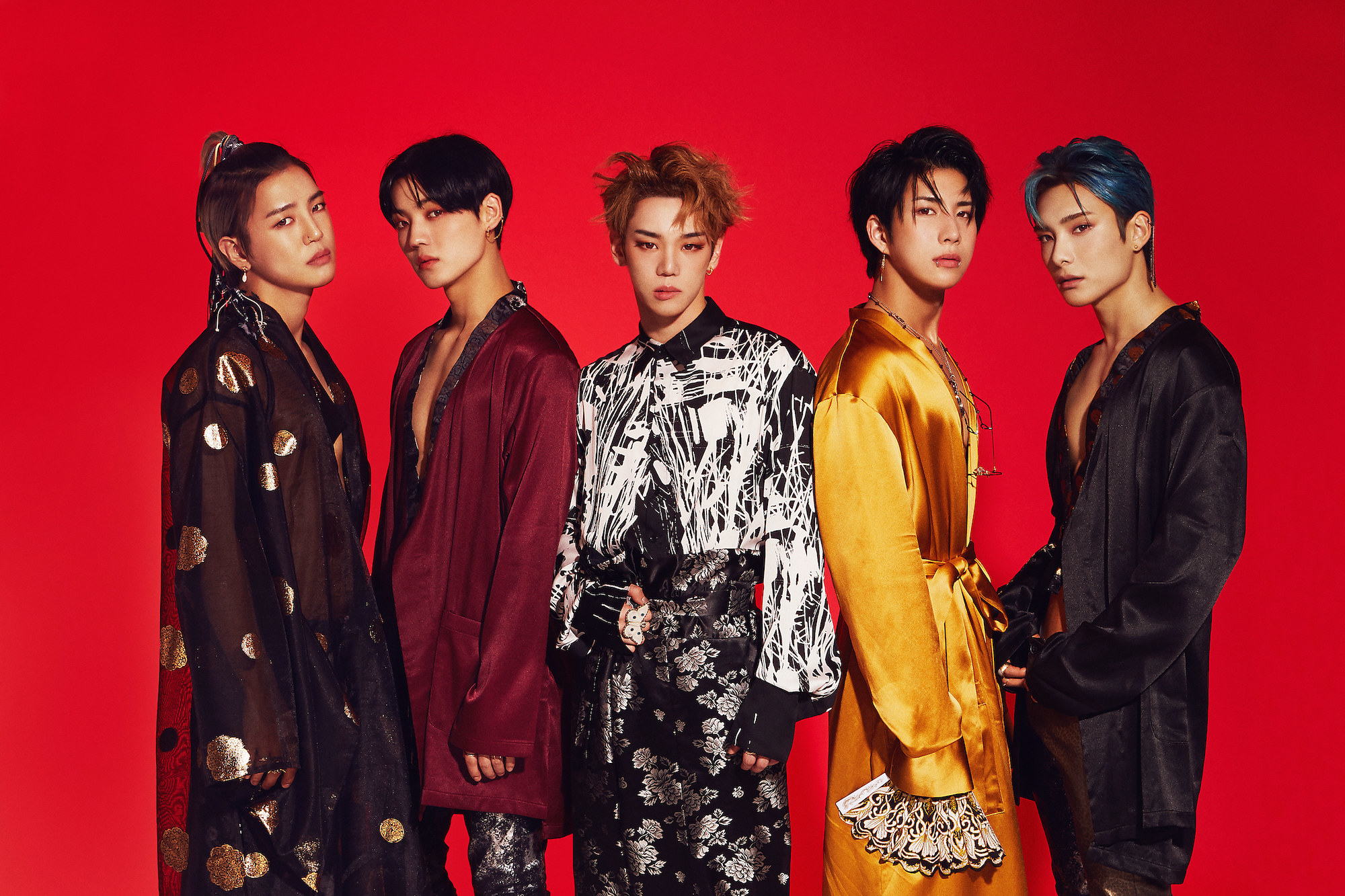 ACE poses together wearing long-sleeved silk shirts 