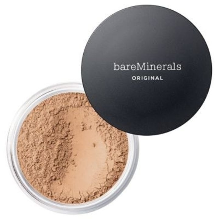 an open container of the powder and a black cap that says bareminerals original on it