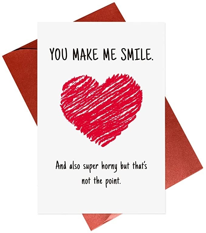 A white card with a drawing of a red heart and &quot;You make me smile, and also super horny but that&#x27;s not the point&quot; in black type
