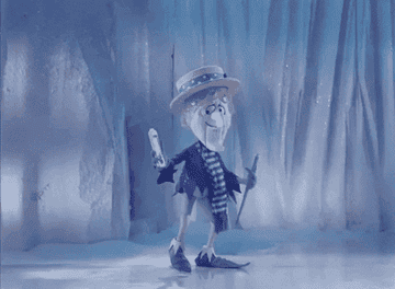 Snow Miser spinning and making snow fall on him