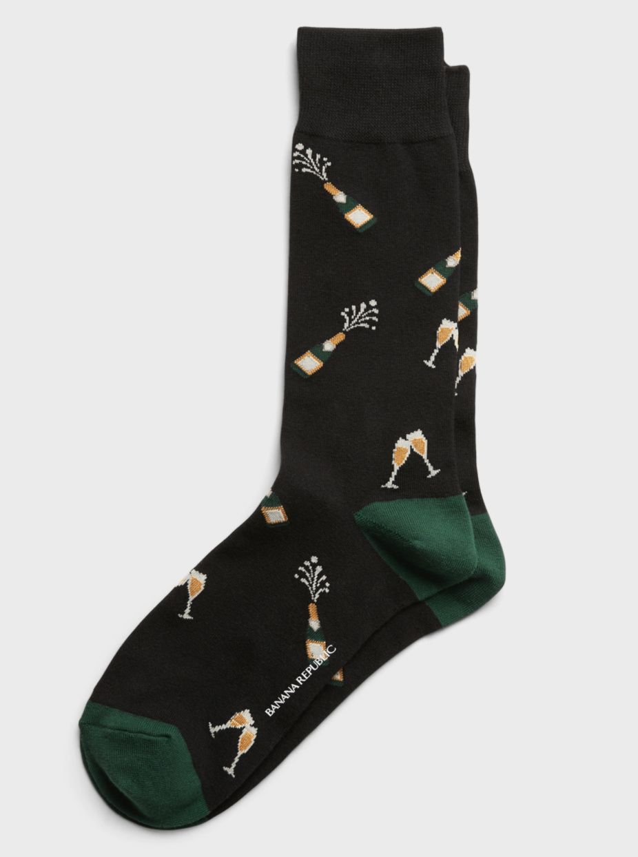 Side view of socks decorated with bottles of champagne and champagne glasses