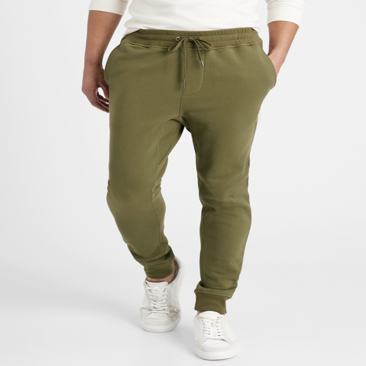 Model wearing French terry joggers in the shade olive you green