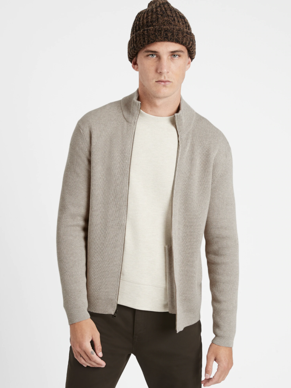 Model wearing Supima cotton sweater jacket in the shade stone gray