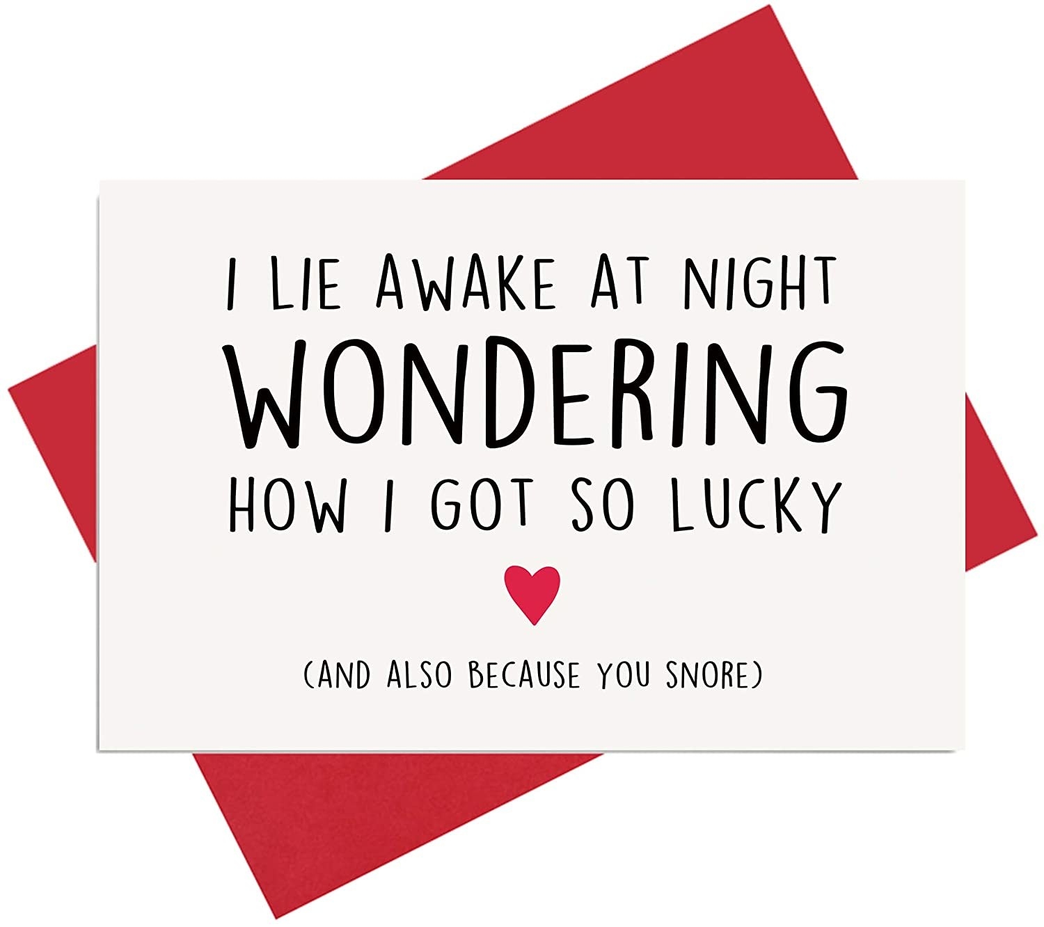 A white card that reads &quot;I lie awake at night wondering how I got so lucky (and also because you snore)&quot; in black type