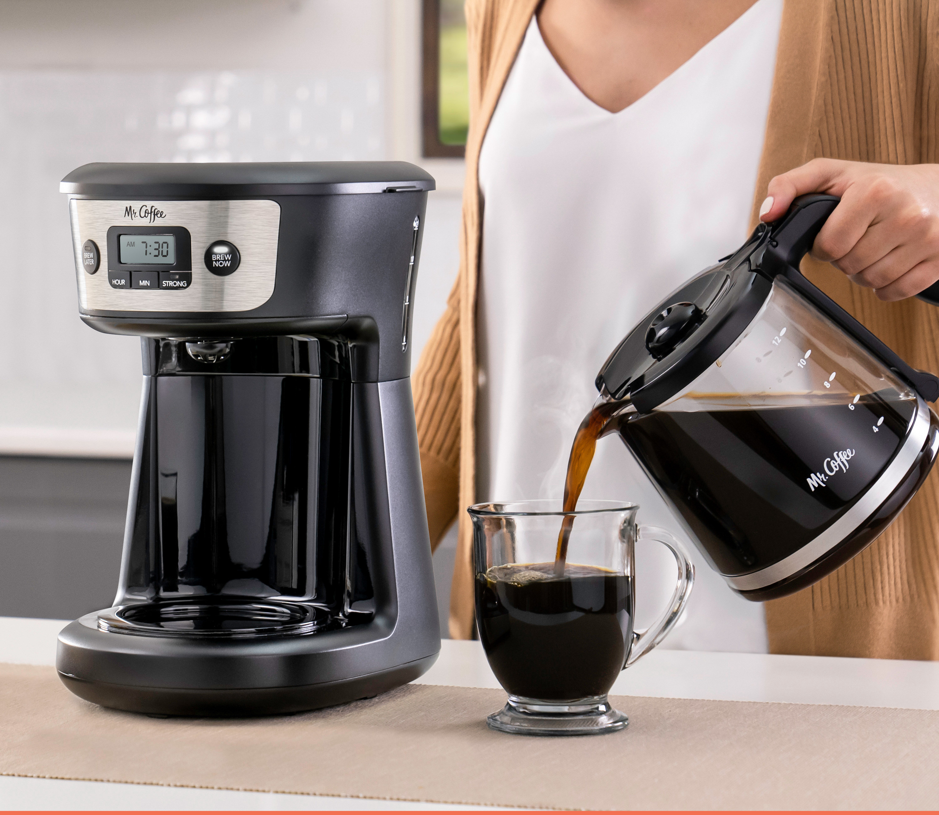 coffee maker on counter and woman pouring coffee from pot