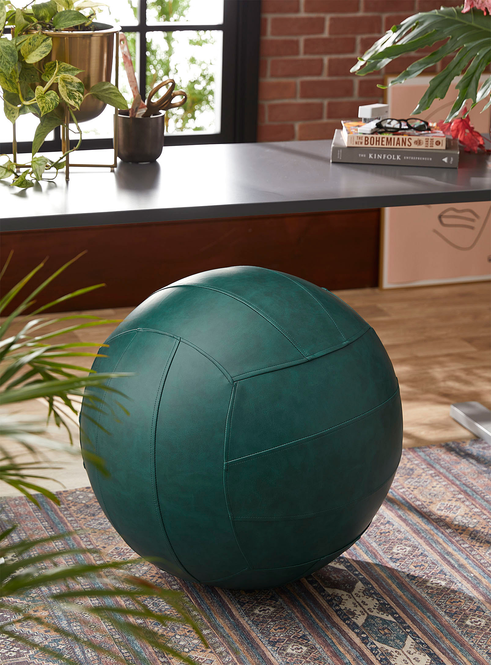 A large faux leather ball on a carpet