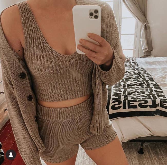 reviewer wearing the three-piece knit set in brown
