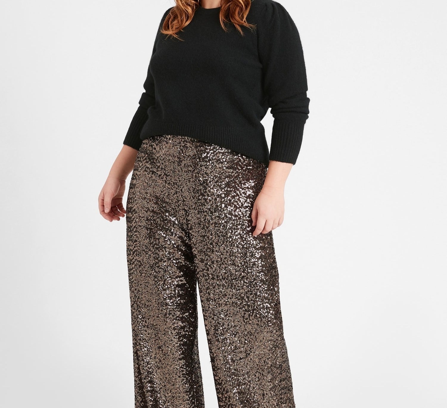 A person wearing the high-rise sequin pants 