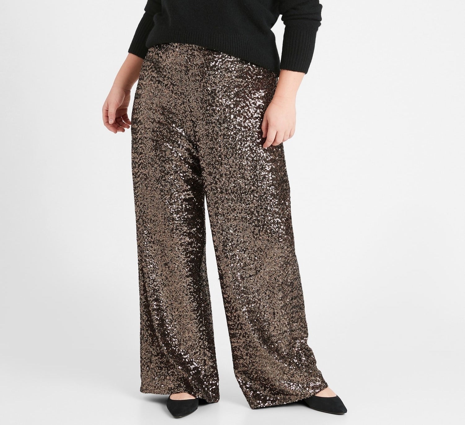A person wearing the high-rise sequin pants 