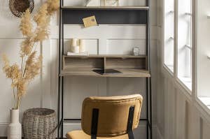 Metal desk frame with manufactured wood desktop and shelving