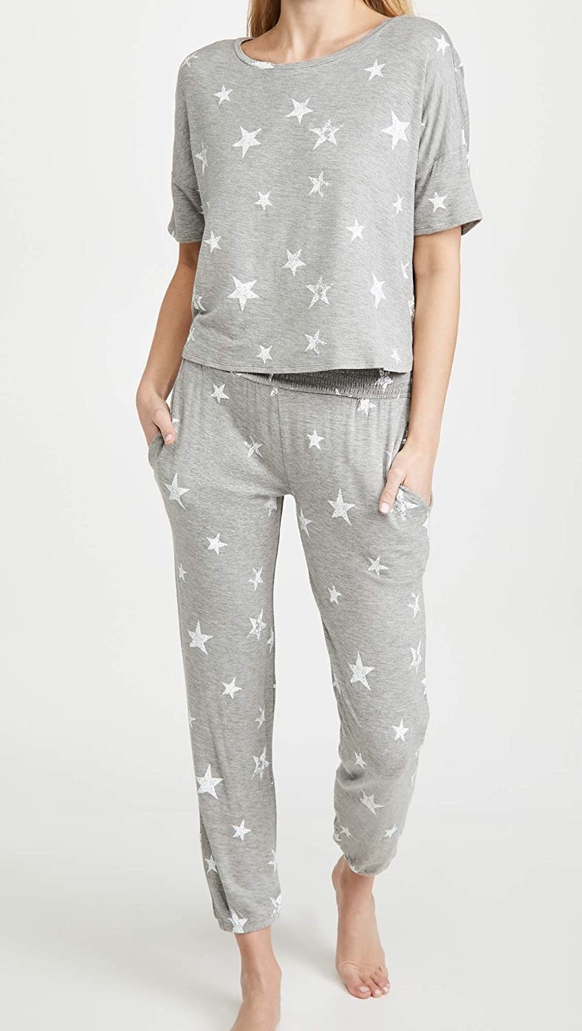 Model wearing grey set with white stars