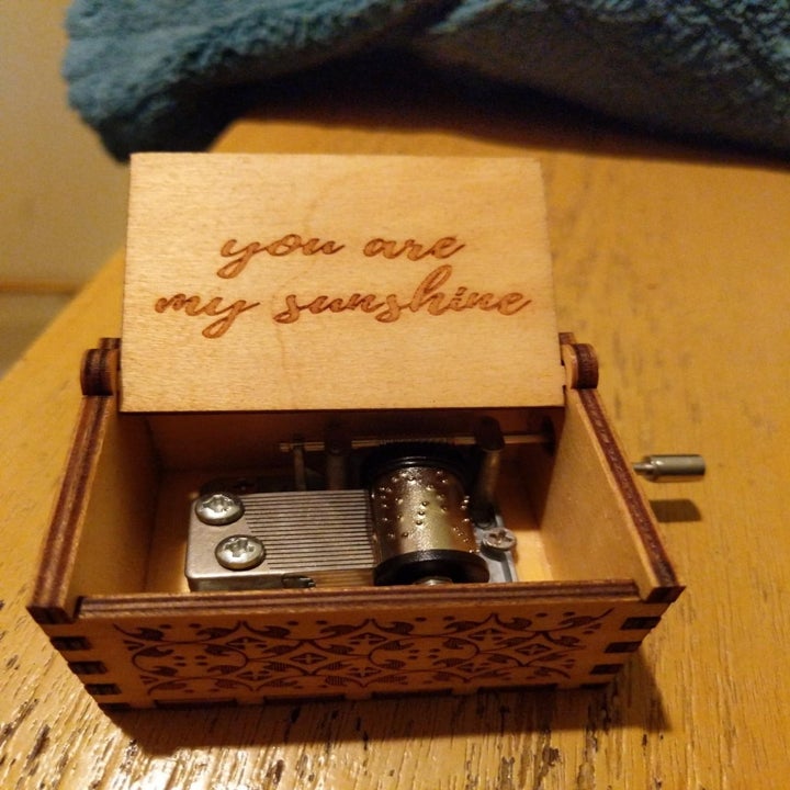The same music box opened with the words "you are my sunshine" engraved on it