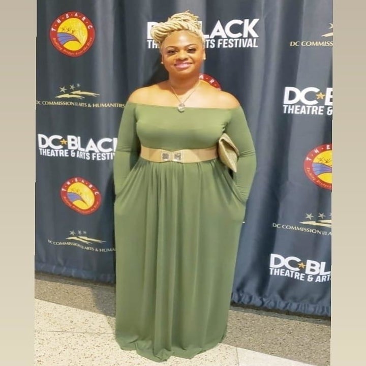 A different reviewer wearing the dress in green