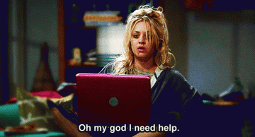 Penny in the big bang theory with knotted hair sitting in front of a laptop saying, &quot;oh my god i need help&quot;