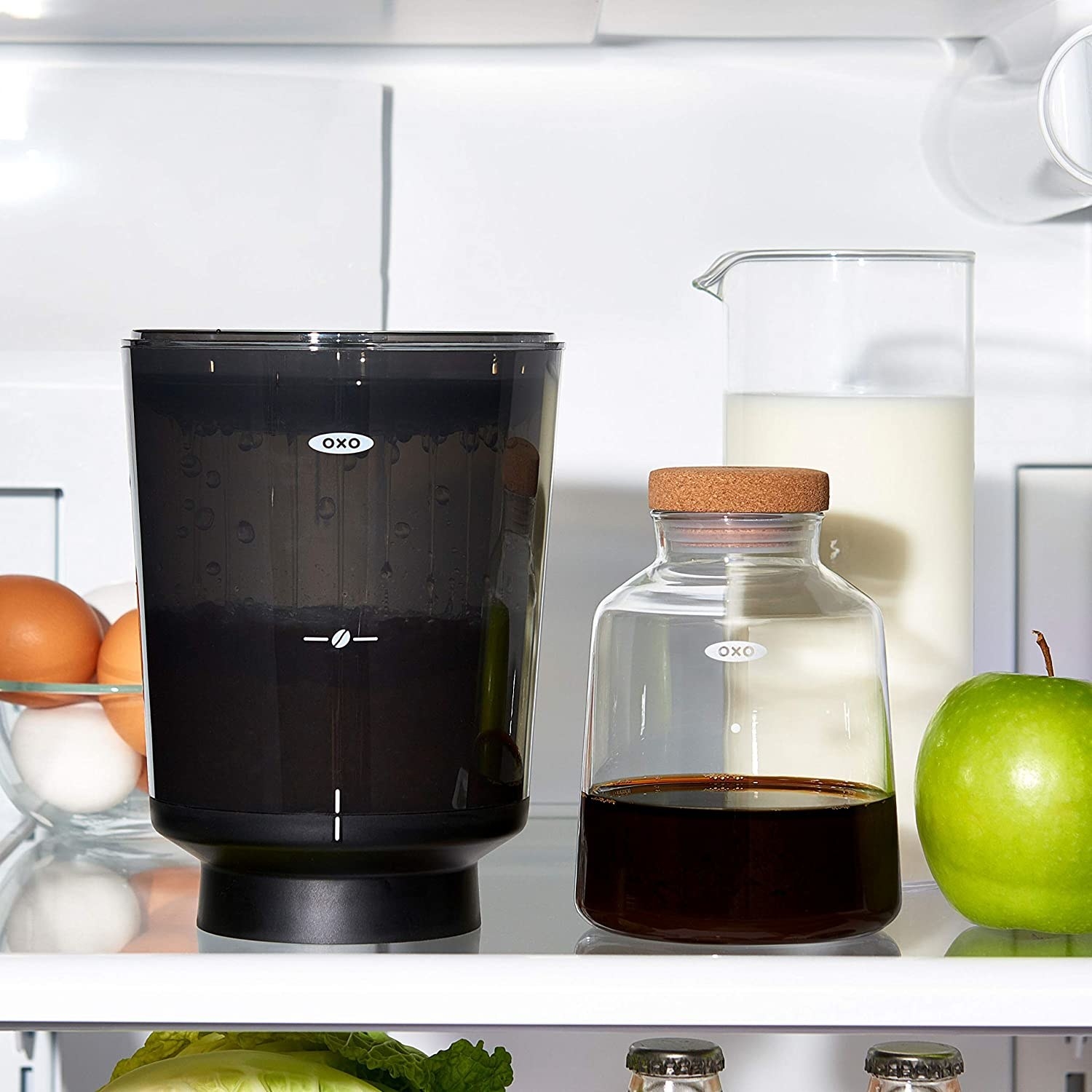 The coffee maker on a shelf in a fridge