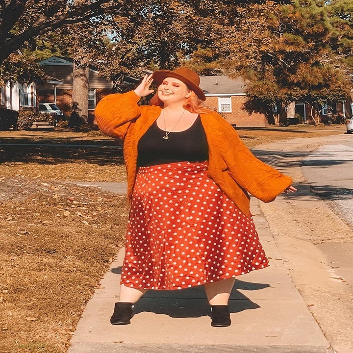 Reviewer wearing the cardigan in orange