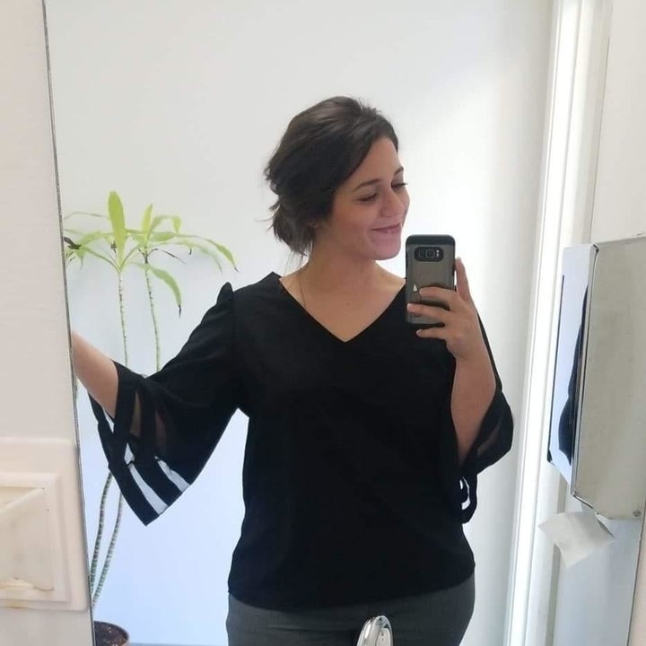 a different reviewer wearing the blouse in black