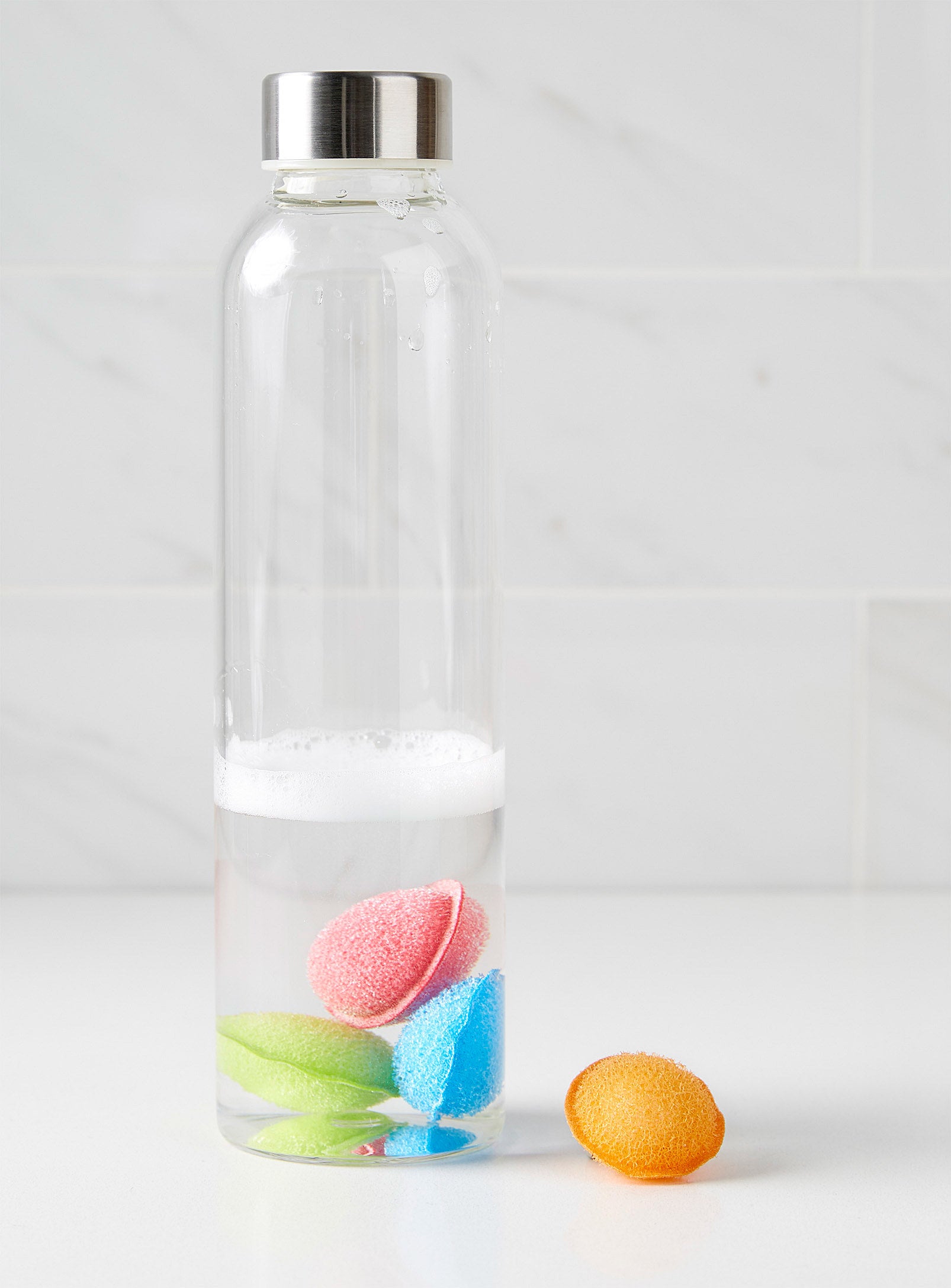 three of the scrubbies in a bottle and one outside