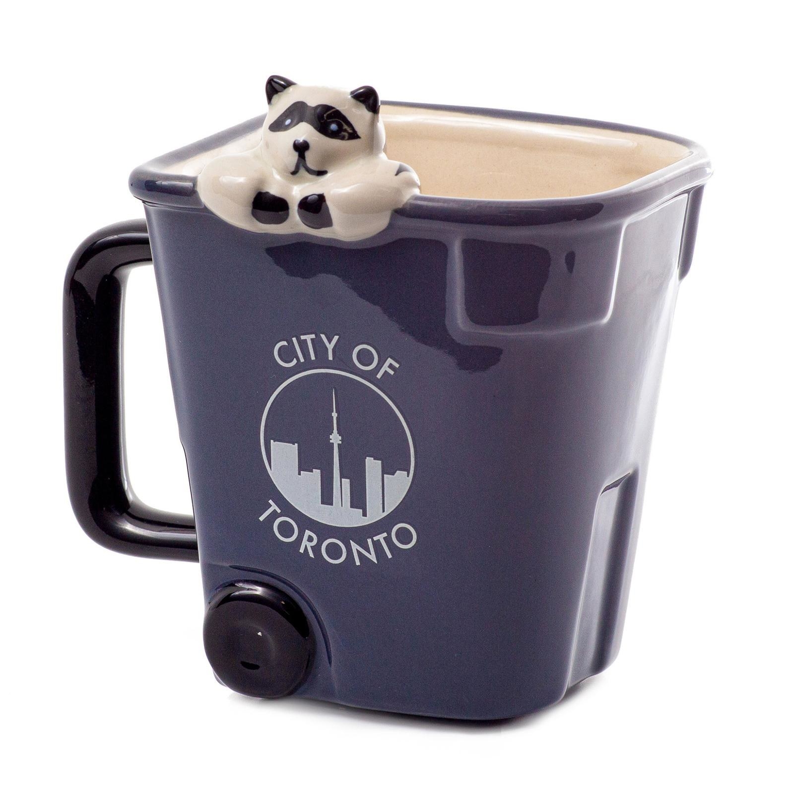 mug that looks like a garbage bin that says city of toronto with a raccoon on the rim 