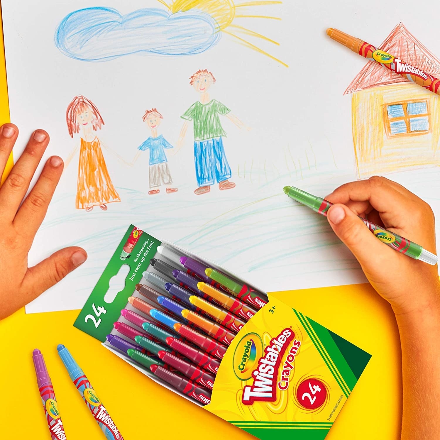 A person colouring with crayons