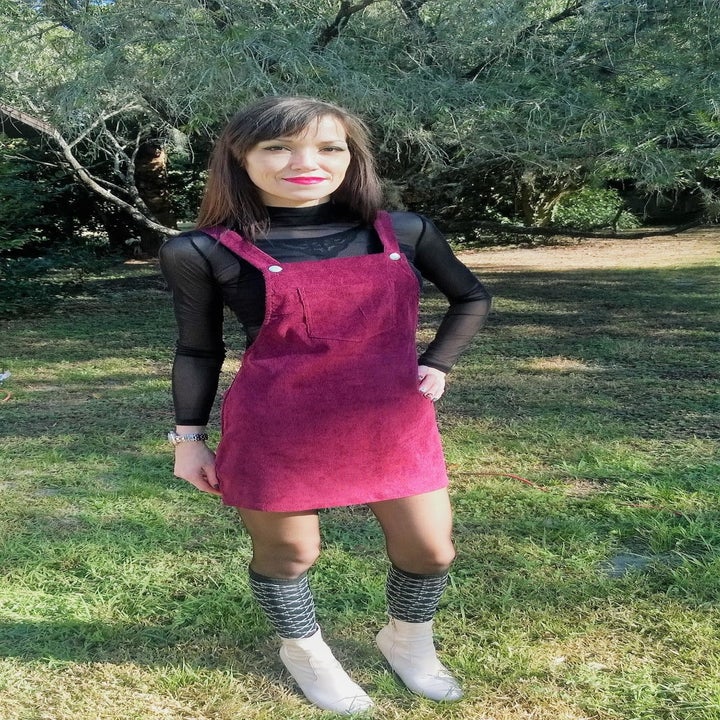 Reviewer wearing the overall dress in red